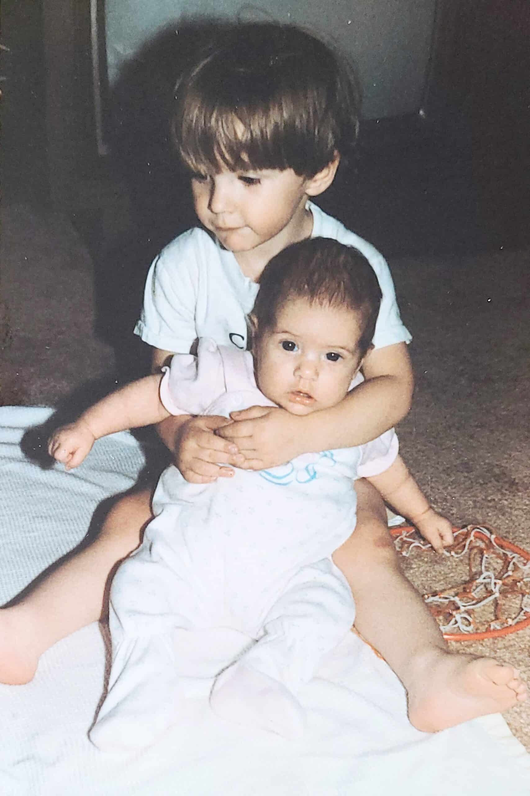 Aaron holding Angie as a baby