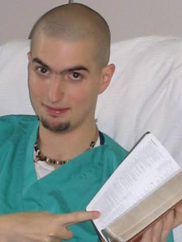 Aaron reading his Bible in the hospital during his final days